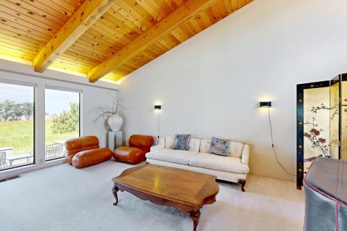 a living room with a couch and a coffee table at Whale Tales in Gualala