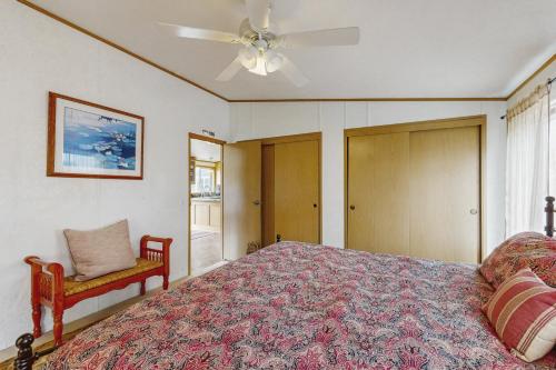 a bedroom with a bed and a ceiling fan at Pacific View Escape in Loleta