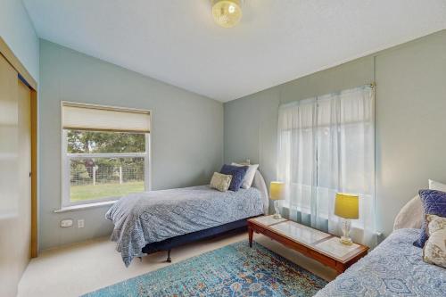 a bedroom with two beds and a window at Pacific View Escape in Loleta