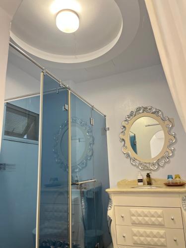 a bathroom with a shower and a mirror at 恆春洋蔥風格旅居 onion in in Hengchun
