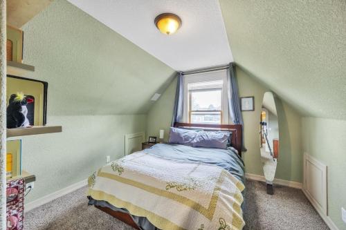 a bedroom with a bed and a window at Stylish 2-Story Home - Perfect Denver Location home in Denver