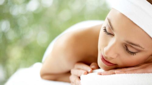 a young woman with a towel wrapped around her head at Crowne Plaza Marlow by IHG in Marlow