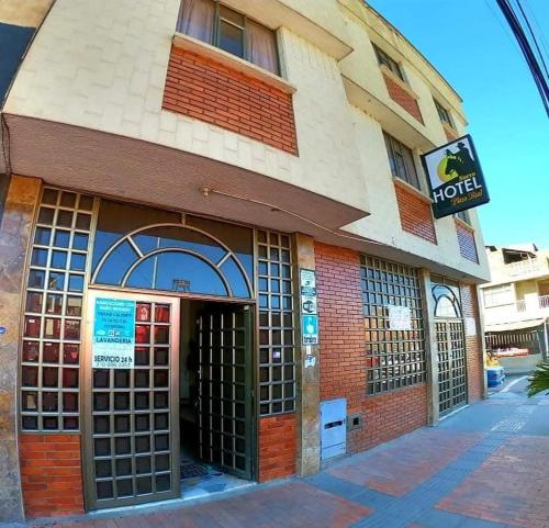 a building with the door open on a street at Nuevo Hotel Plaza Real in Sogamoso