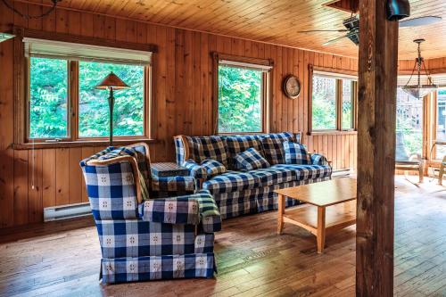 a living room with two couches and a table at Sous Bois & Loft - Hot tub - Ski out in Mont-Blanc