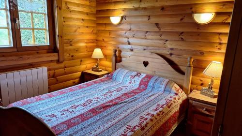 เตียงในห้องที่ Chalet scandinave excellente situation GERARDMER XONRUPT