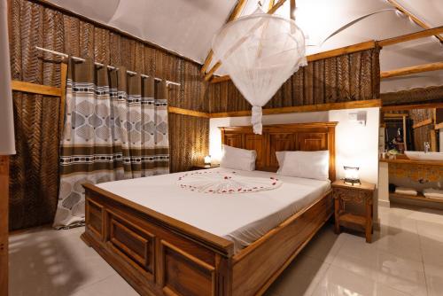 Postel nebo postele na pokoji v ubytování Diacarisma Boutique Resort Nungwi