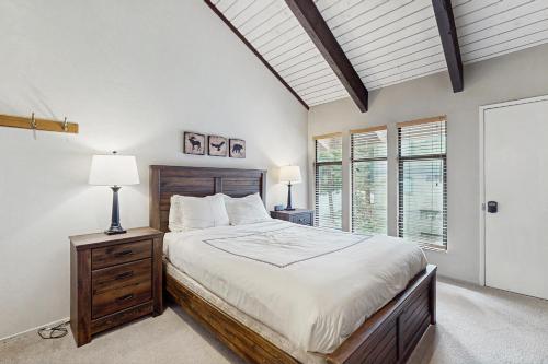 a bedroom with a large bed and a window at St. Moritz 13 in Mammoth Lakes