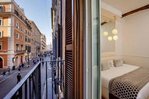 Giường trong phòng chung tại Relais Luxury Corso