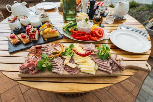 a table with a tray of different types of food at Resort - D9 in Želnava