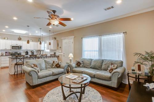 a living room with a couch and a table at Happy Place by Bolivar Escapes in Crystal Beach