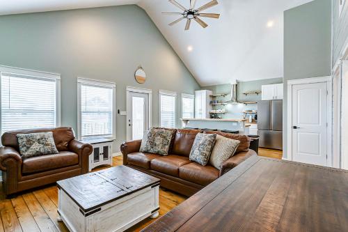 a living room with a couch and a table at Sea You Soon in Port Bolivar