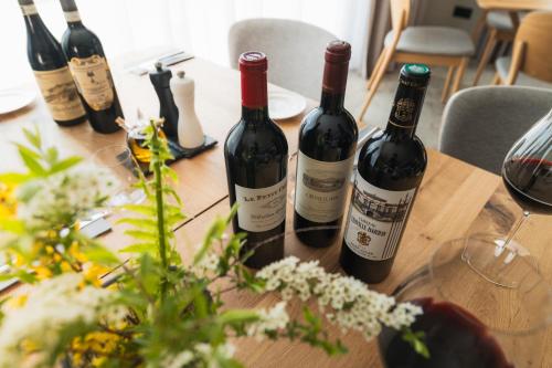 a bunch of wine bottles sitting on a table at Resort - D9 in Želnava