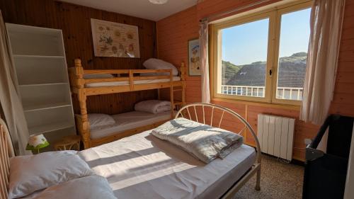 Katil atau katil-katil dalam bilik di Appartement Fort-Mahon Plage vue mer 50m plage parking privé