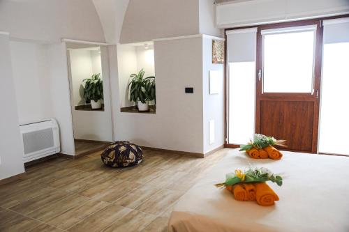 a room with a table with pumpkins on it at Dante 25 in Triggiano