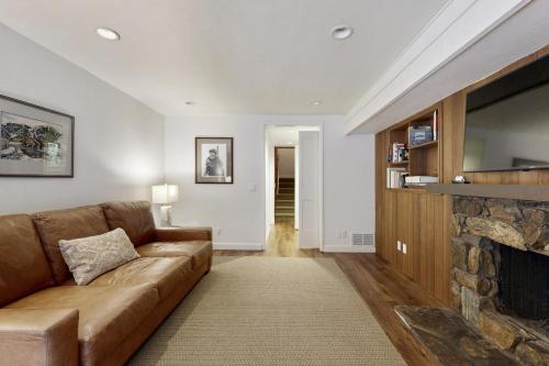 a living room with a couch and a fireplace at Sun Valley Alpenglow in Ketchum