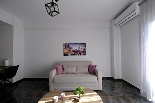 a living room with a couch and a table at Eva House 1 in Drama