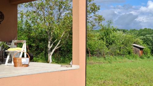 two pictures of a porch with a chair and a field at Maki Village in Bukorovac