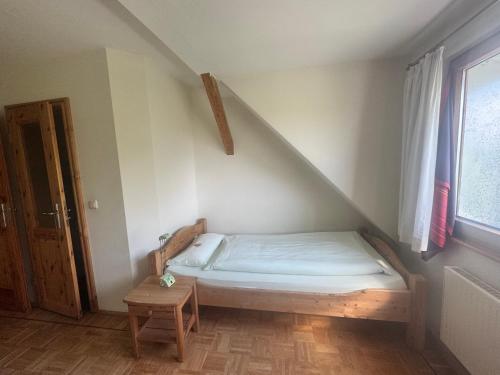 Postel nebo postele na pokoji v ubytování Hotel Grünwald