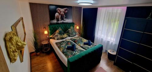 a room with a green couch in a room at Ferienhaus Mefady Jünkerath in Jünkerath