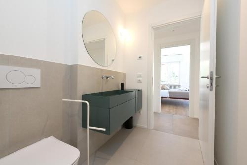 a bathroom with a black sink and a mirror at MGH - Malcesine Supreme Stay in Malcesine