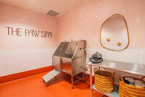 a dressing room with a sink and a mirror at 1BR Modern Apartment in DT HighRise with Gym, Parking, Pool and W-D in Phoenix