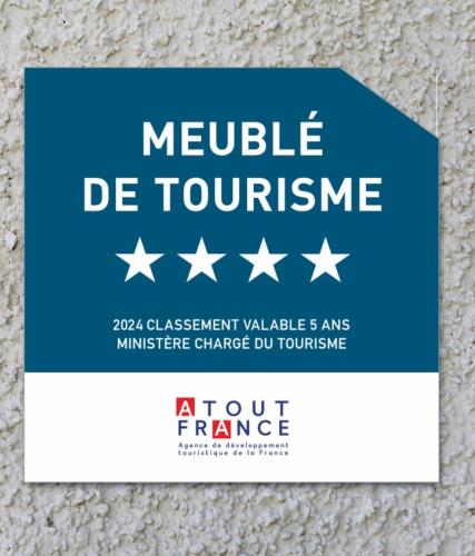 a blue and white sign with white stars at Les Lodges de Saint Cassien in Montauroux