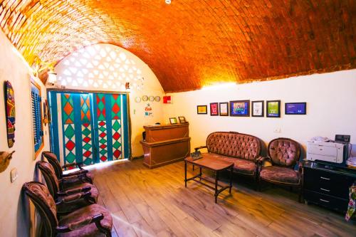a living room with a couch and a table at Fenti Nubian Resort in Aswan
