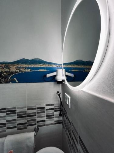 a bathroom with a toilet with a view of the water at Suite Torre Azzurra B&B - Rooftop Sea View in Follonica
