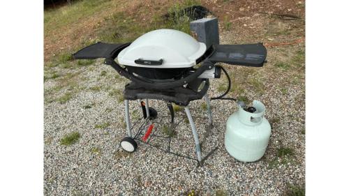 a bbq grill with a pot on top of it at Edgar at Lake George Winery at Tiny Away in Collector