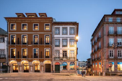 a group of buildings on a city street at Exmo Hotel by Olivia in Porto