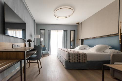 Postel nebo postele na pokoji v ubytování Hotel Mezquita Center