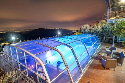 a swimming pool on the roof of a building at Shalvat Mitzpe Kinneret in ‘Ein el Asad