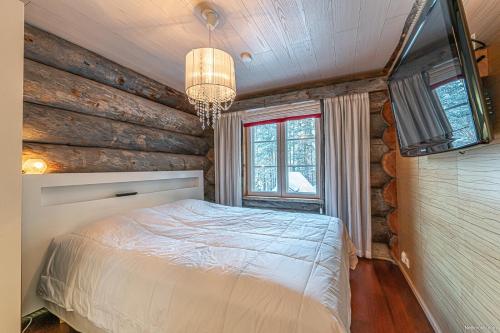 Ένα ή περισσότερα κρεβάτια σε δωμάτιο στο Levin Kreivi by Hilla Villas