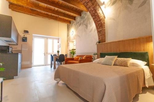 a bedroom with a large bed and a dining room at Switch Holiday 312 in La Spezia