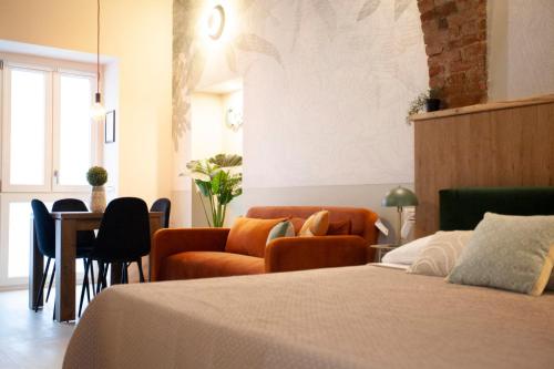 a hotel room with a bed and a table and chairs at Switch Holiday 312 in La Spezia