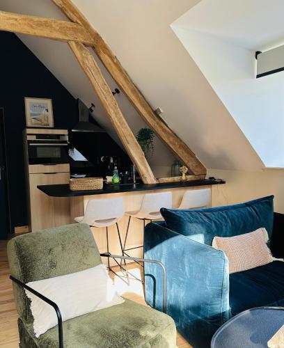 a living room with two chairs and a couch at la madrague des 2 caps in Audembert