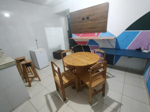 a kitchen with a table and chairs in a room at Residencial Romulo Ap 4 in Manaus