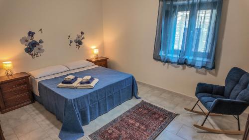 a bedroom with a bed and a pair of slippers at Asteria Guest&Artist House - Casa Tersìcore in Roseto Valfortore