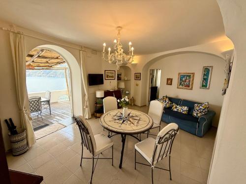 a living room with a table and a couch at Villa Anna in Maiori