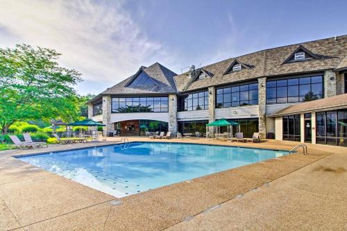 a swimming pool in front of a building at Gorgeous Resort, Fish Private Lake, Pools, Golf! in Branson West