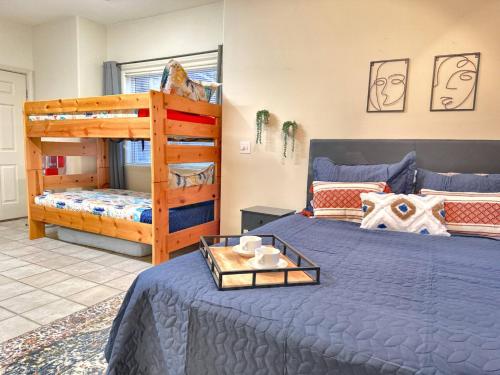 a bedroom with two beds and a bunk bed at Gorgeous Resort, Fish Private Lake, Pools, Golf! in Branson West