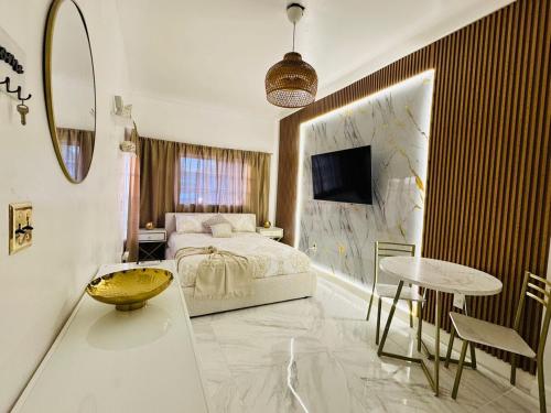 a bedroom with a bed and a table in a room at Stylish Studio in Heart of Miami in Miami