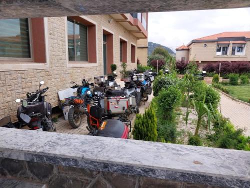 a group of motorcycles parked outside of a building at AUBERGE JOMANA PARK in Azrou