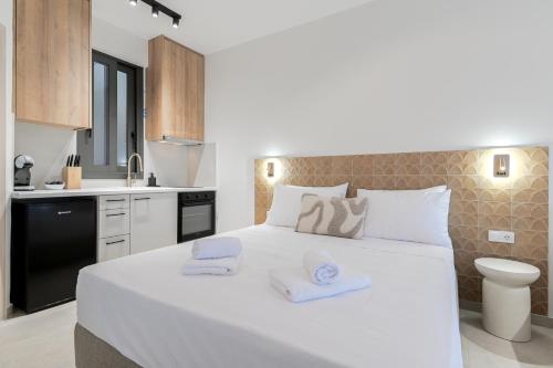 Giường trong phòng chung tại ZEN BLU Boutique & Suites