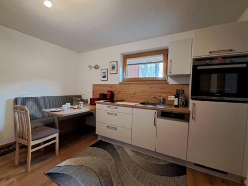 a kitchen with a sink and a counter top at Apartment Daniela-7 by Interhome in Niederau
