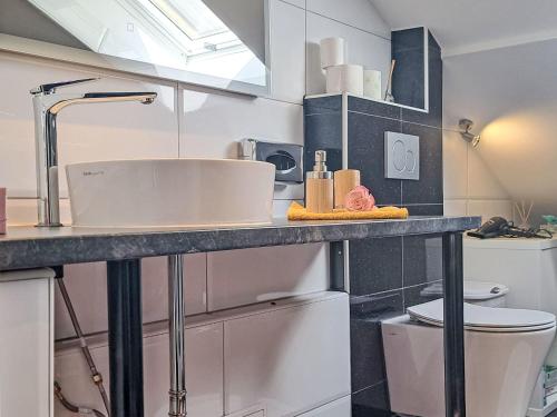 a bathroom with a sink and a toilet at Apartment Siebter Himmel by Interhome in Bad Ischl