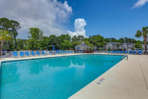 a large swimming pool at a resort at Ground-Floor Myrtle Beach Condo with Community Perks in Myrtle Beach