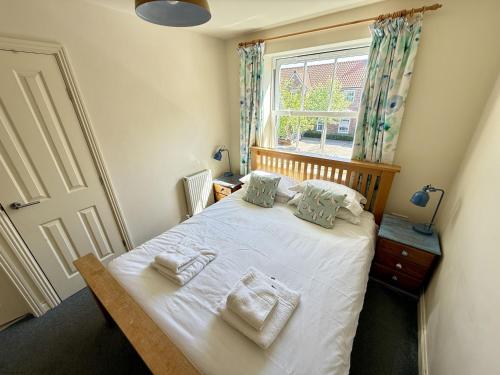 Ένα ή περισσότερα κρεβάτια σε δωμάτιο στο Lighthouse Apartment