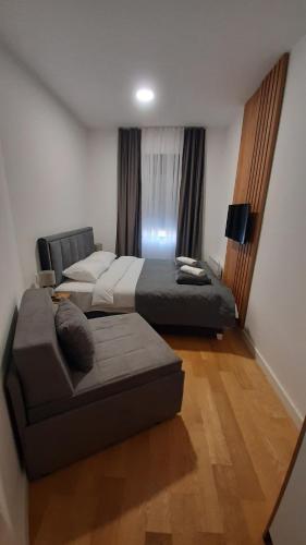 Postel nebo postele na pokoji v ubytování Balkan Square 55