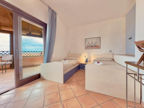 Postel nebo postele na pokoji v ubytování Smeralda Residence